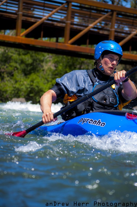 Trevor Lyden kayaking the Deschutes River off the first street rapids , photo by Andrew Herr