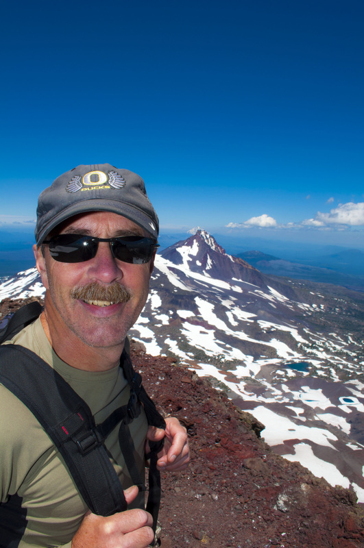 Steve Herr on the summit of South SIster, photo by Andrew Herr